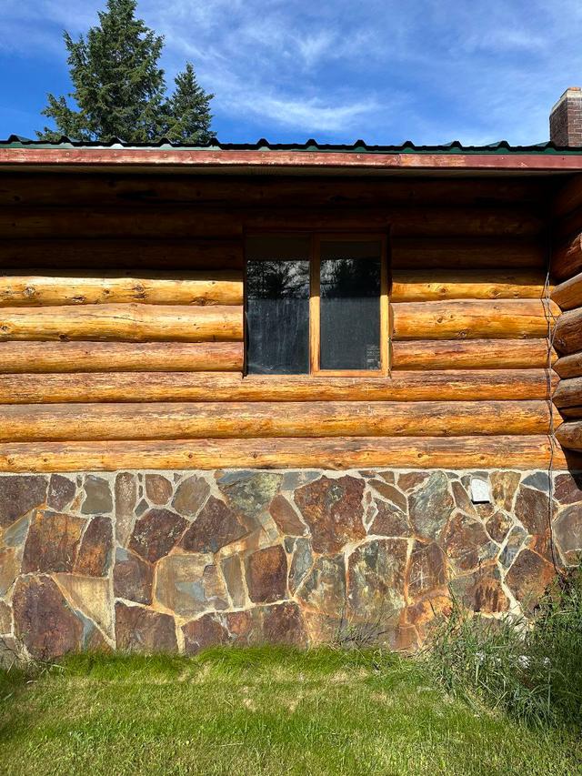 Newly installed windows in a log home wall