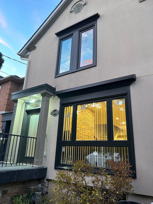 Exterior of a home with newly installed windows and doors