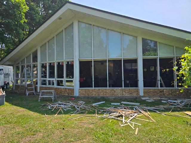 Exterior of a home with newly installed windows and doors
